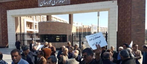 The workers are protesting in front of Khuzistan province
