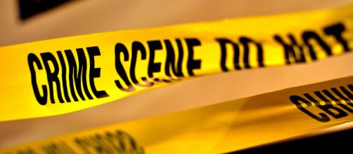 Yellow crime scene tape set up by police. - [Image via puamelia - Flickr]
