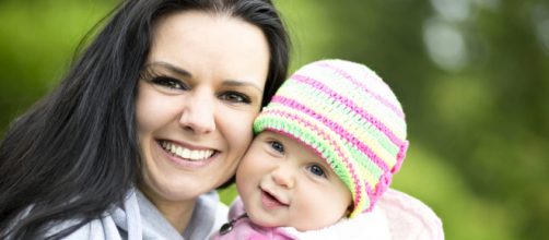 A happy mother with her baby. Photo Credit: publicdomainpictures.net