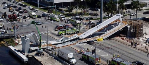 Miami pedestrian bridge collapses, killing four people, crushing ( image credit CBS-Youtube.com)