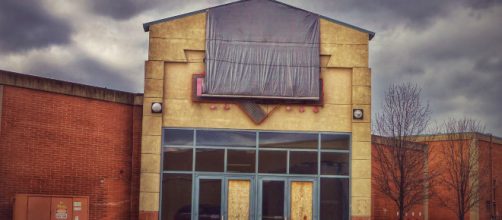 An abandoned store front. - [Image credit: Nicholas Eckhart via Flickr]