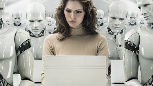 In alto, dipendenti robotici intenti a svolgere mansioni informatiche