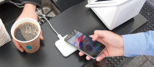 'Apple Pay' being used at checkout for coffee - (Image via Apple Payment Square/Wikicommons)