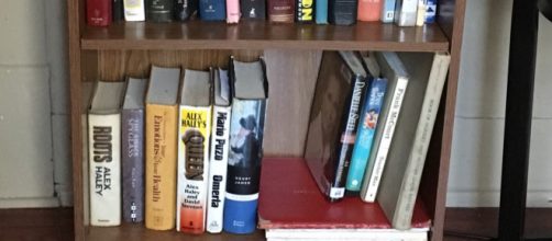 Lifehack to steady a loose shelf in a bookcase. (Image via Cheryl E. Preston/Author).