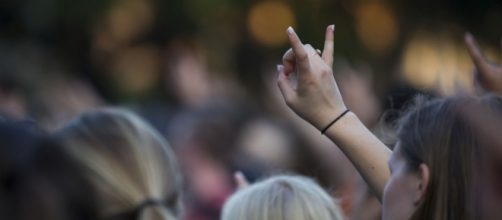 UT students raising our horns in solidarity at the memorial last year. - [Photo via: Flickr &mdash; Image Credit: KUT Austin - 90.5 FM]