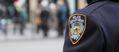 New York City Police officer stands guard (Image via Dave Hosford - Flickr)