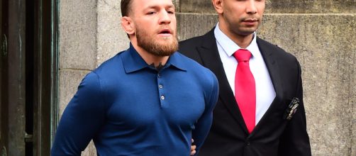 Irish boxer under arrest for attacking bus.