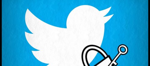 Twitter logo and lock with key - Esther Vargas via Flickr