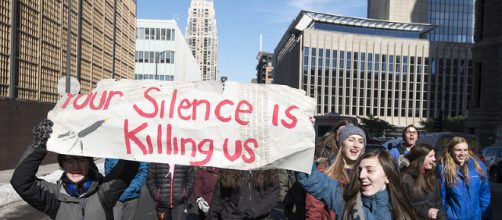 Students protest the lack of action in school shootings. - [Image source: Fibonacci Blue via Flickr]