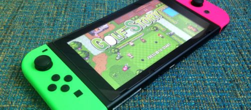 Nintendo Switch with neon green and pink/Joy-Cons via Flickr