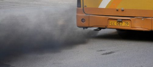 Bus leaving a trail of black smoke. - [Image credit &ndash; Ilya Plekhanov / Wikimedia Commons]