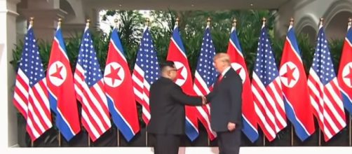 The leaders of North Korea and the United States shake hands. - [Image Source: ABC News / YouTube screencap]