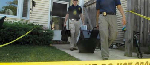 Detectives at a crime scene [Image source: Senior Airman Renae L. Kleckner - US Air Force]