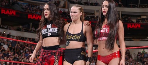 Oddsmakers don't expect the team of Ronda Rousey and The Bella Twins to lose at WWE Super Showdown. [Image via WWE/YouTube]