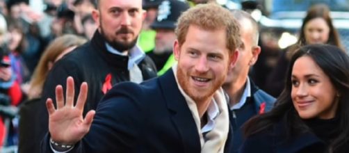 Harry and Meghan waving to others. [Image source/Breaking News YouTube video]