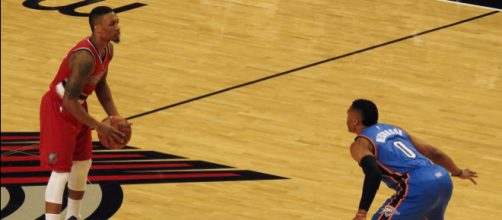Damian Lillard squaring off against former MVP award winner Russell Westbrook. [image source: James Schumacher- Wikimedia Commons]