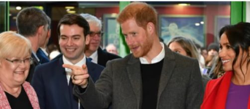 Pregnant Meghan Markle and Prince Harry with others. [Image source/E! News YouTube video]