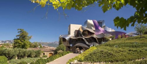 This stunning design by architect Frank O. Gehry is one example of unique and unusual architecture in this world. [Image courtesy Booking.com]