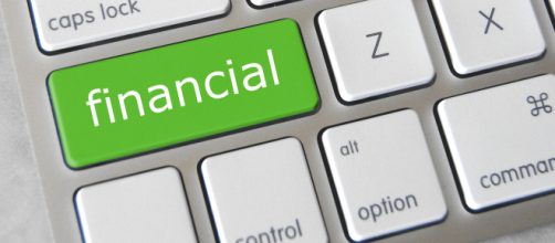 Financial green key on a keyboard - - [GotCredit / Flickr]