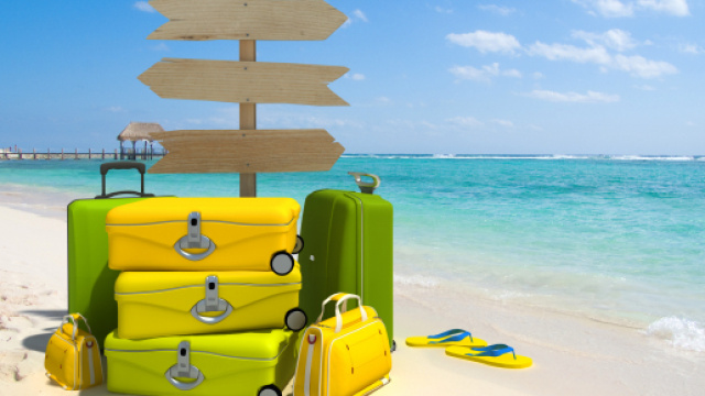 Vacanze estive al mare e valigie