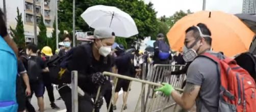 Hong Kong airport cancels flights over protests. [Image source/BBC News YouTube video]