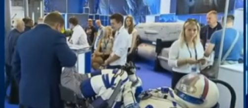 Russian Cosmonauts reveal sleek new Space Suit! Next Gen of explorers won&rsquo;t be in rubber! [Image source/Vesti News YouTube video]