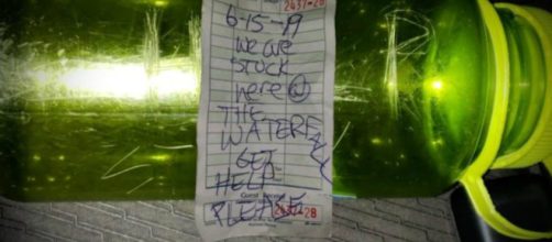 The bottle and the SOS message. [Image credit: Curtis Whitson]