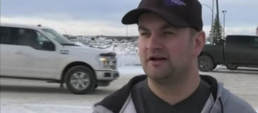 Alberta oil-worker pours warm coffee to rescue kittens whose tails were frozen to the ground . [Image Source: CTV News/YouTube]