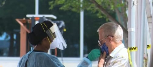 US sets record high for daily new coronavirus cases, over 142,000 infections reported. [Image source/South China Morning Post YouTube video]