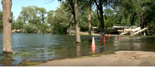 Rising sea levels, high-tide flooding and the impact climate change is having on U.S. coasts. [Image source/CBS News YouTube video]