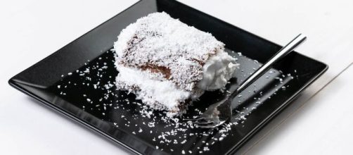 This layered cake combines chocolate and coconut to create an explosion of flavor. [Image Source: Marco Verch/Flickr]