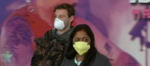 Travelers return to a new reality as Australia enforces coronavirus self-isolation. [Image source/ABC News (Australia) YouTube video]