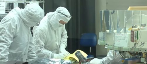 Scientists work on NASA CubeSats - satellite small enough to fit in your hand. [Image source/NASAeClips YouTube video]