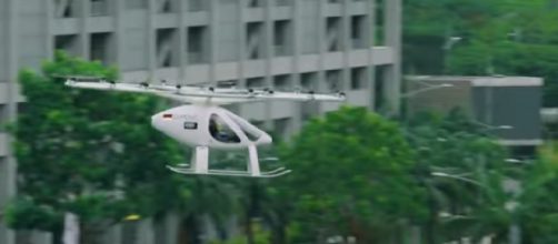 One of Volocopter&rsquo;s flying taxis over Marina Bay, Singapore. [Image source/CAN YouTube video]