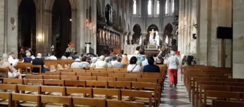 Inside the Notre Dame Cathedral in Paris. [Image source/Explore France YouTube video]