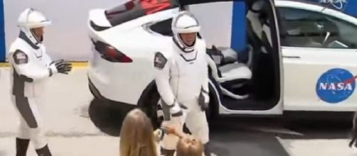 SpaceX Demo-2 astronauts wave goodbye to their families. [Image source/ABC News YouTube video]