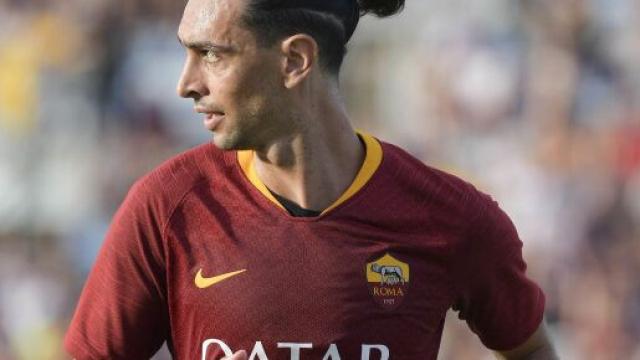 Pastore in Latina-Roma con la maglia giallorossa.
