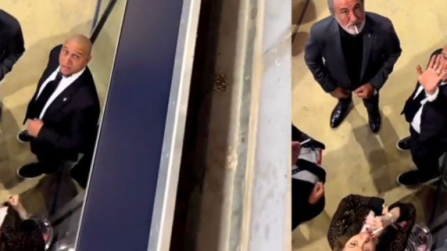 Roberto Carlos fume sa cigarette en compagnie de connaissance lors de Br&eacute;sil Suisse Source : Capture Twitter