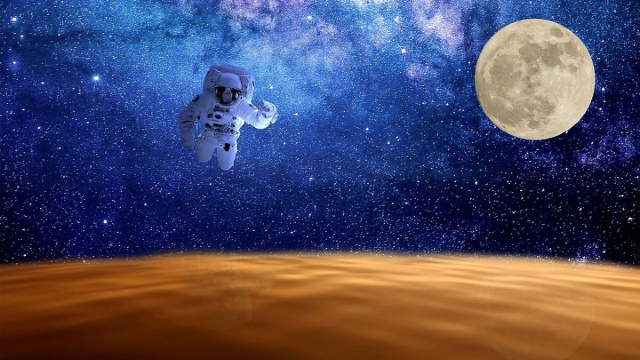Un'astronauta sospeso nello spazio tra Terra e Luna &copy; Pixabay.