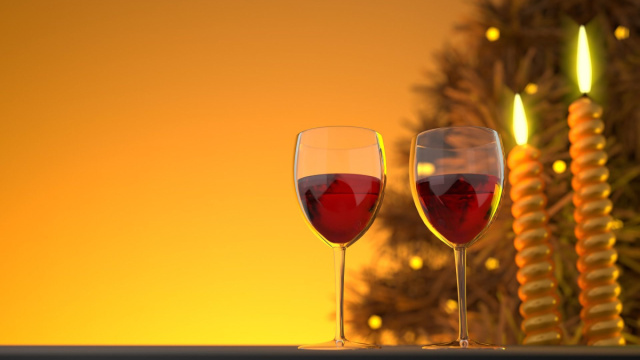 Calici di vino rosso con candele e albero di Natale - &copy; Pixabay.