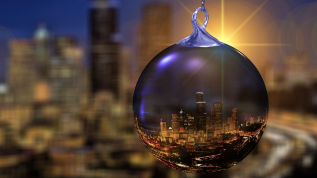 Una pallina di Natale con palazzi e luci - pixabay.com