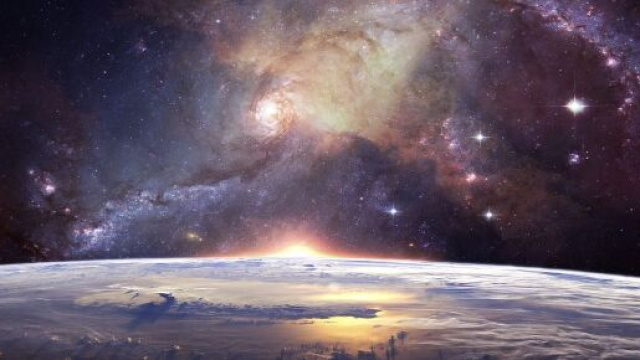 Una galassia di stelle a spirale e la Terra &copy; Pixabay.