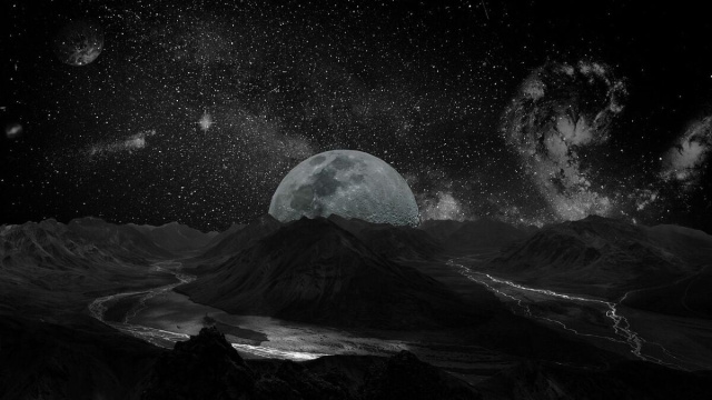 La Luna di fronte alla Terra primordiale &copy; Pixabay.