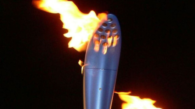 La fiamma olimpica (Wikimedia Commons).
