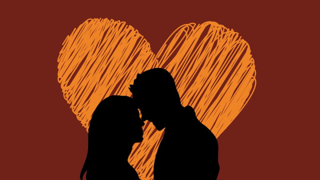 Coppia su sfondo a cuore &copy; Pixabay