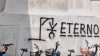 Graffito con omino impiccato contro l'attivista della lega Eterno